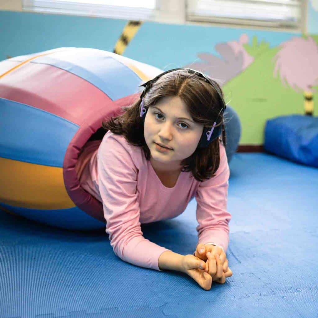 girl playing with gym toy